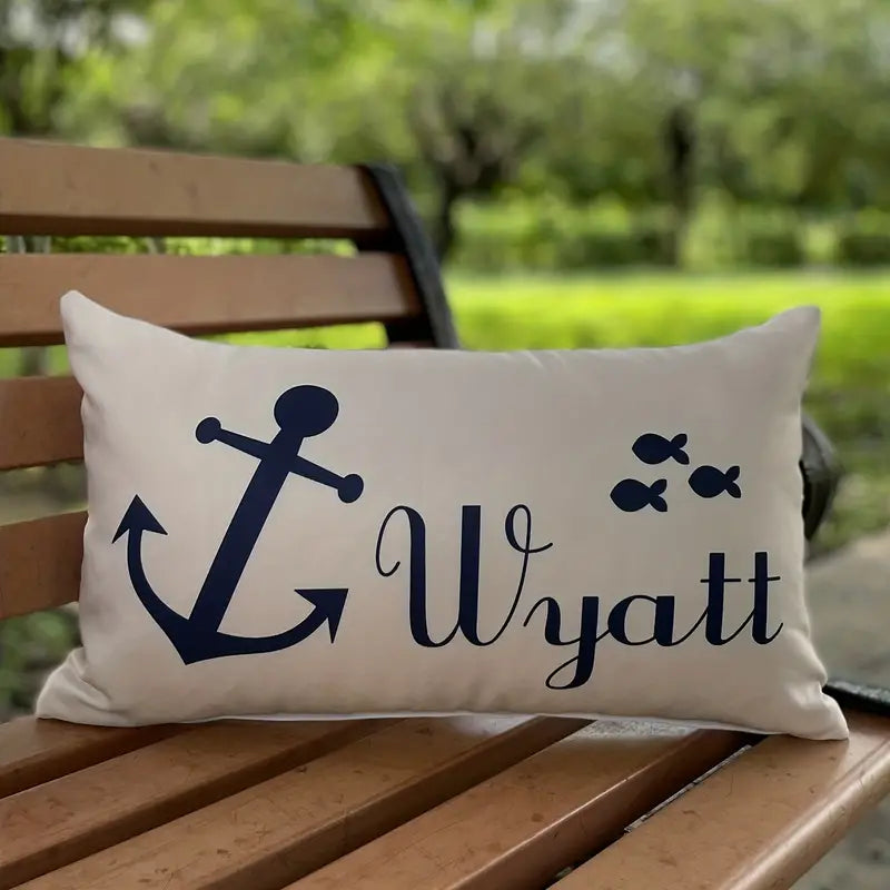 White lumbar pillow cover featuring a navy blue anchor, three small fish silhouettes, and "Wyatt" script typography with a hidden zipper for nautical décor - 12x20 - Coastal Pillows Plus