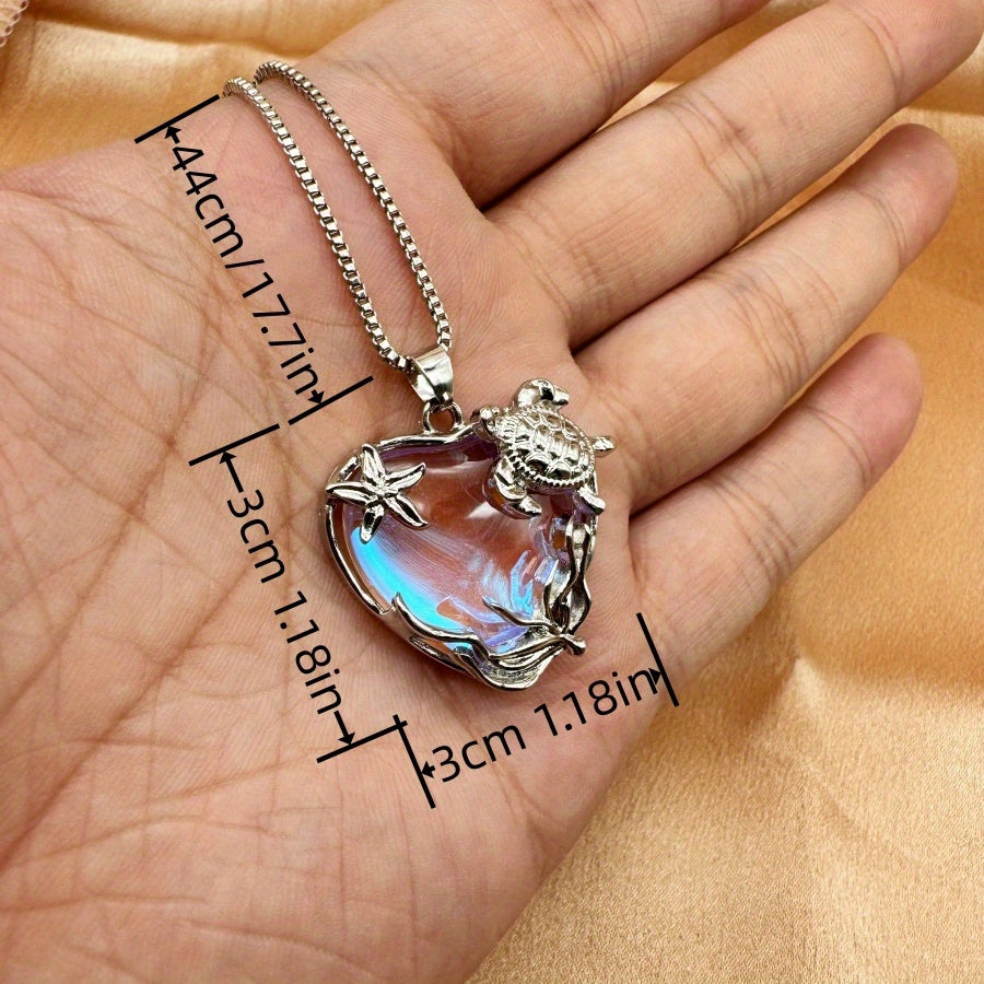 Captivating turtle necklace featuring a shimmering heart pendant for a stylish and romantic coastal home décor.