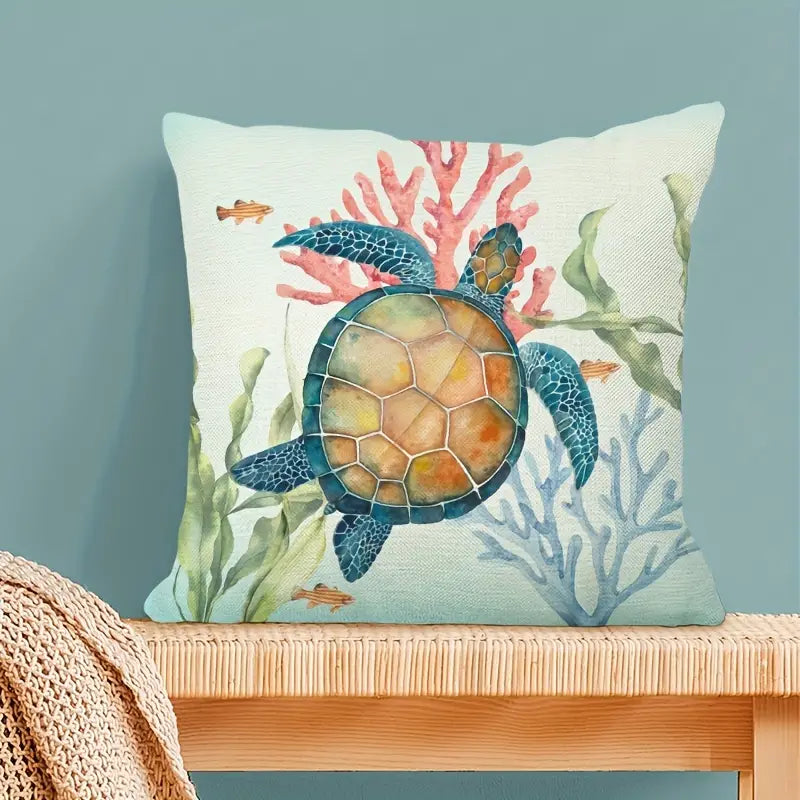 Square coastal pillow cover featuring a detailed watercolor illustration of a sea turtle swimming among pink and blue coral reefs with sea grass and small tropical fish for nautical décor - 18x18 - Coastal Pillows Plus