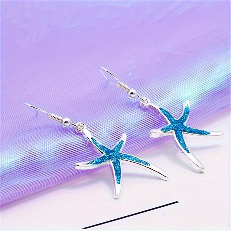 Elegant blue starfish earrings with a polished finish, perfect for a sophisticated ocean-inspired décor lifestyle.