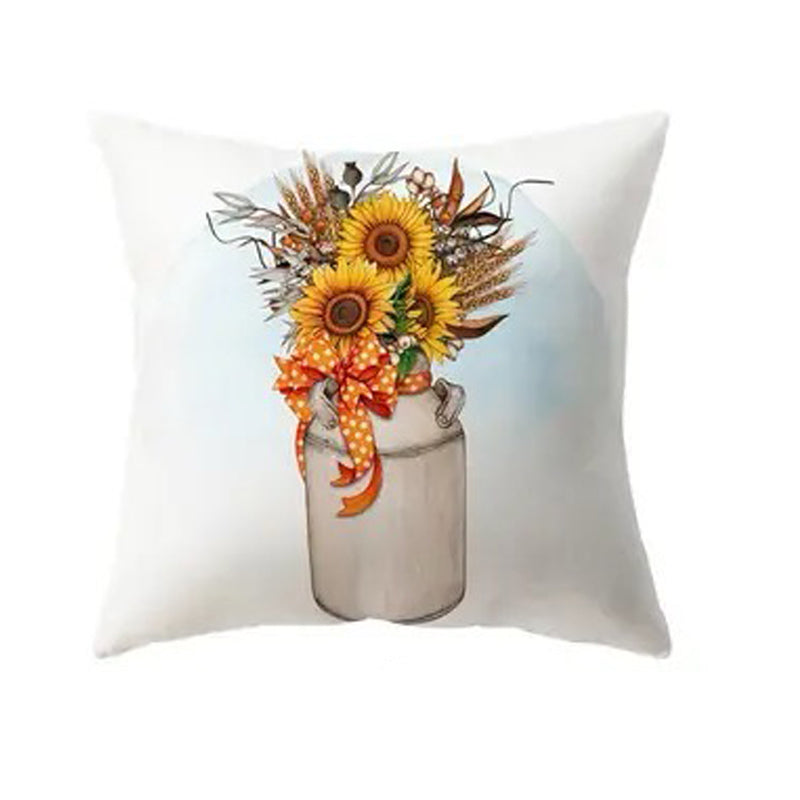 Pillow cover displaying sunflowers arranged in a rustic container with fall foliage accents.