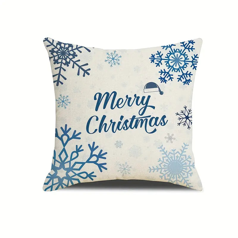 Blue and white coastal Christmas pillow cover with snowflakes and Merry Christmas text on a light background.