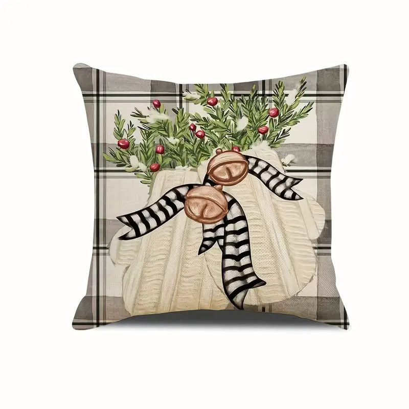Farmhouse Christmas pillow cover featuring vintage bells with greenery on a plaid background.