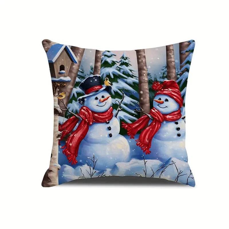 Mr and Mrs snowman pillow cover with two snowmen in red scarves standing in a snowy forest winter scene with birdhouse and snow-covered trees