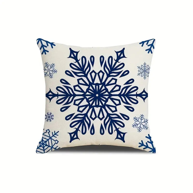 Navy blue outdoor pillow cover featuring large blue snowflake design on light background.