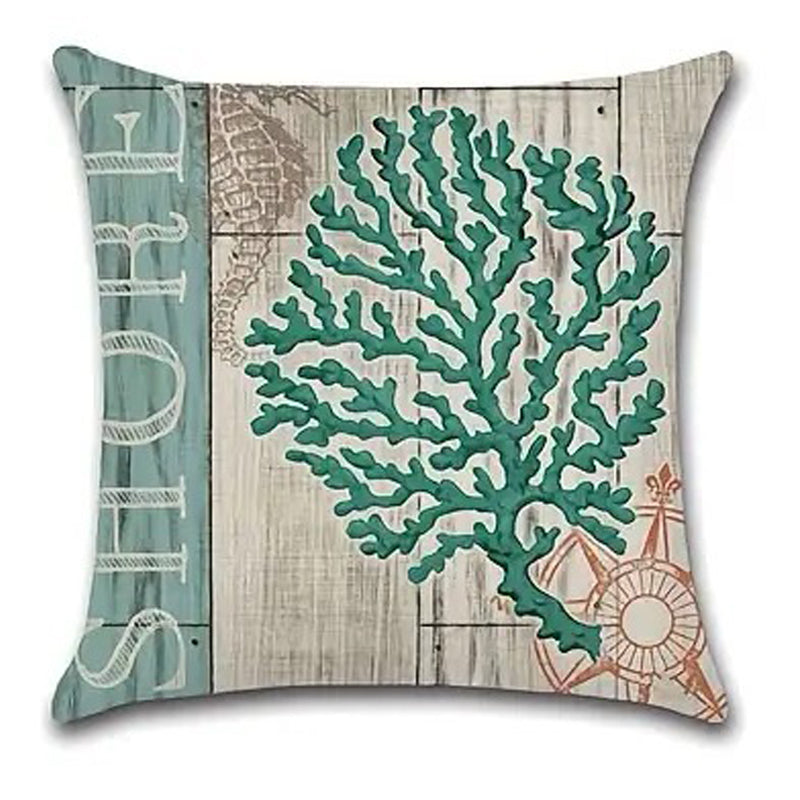 Pillow cover featuring a rounded teal coral cluster design on a weathered wood-style coastal background.