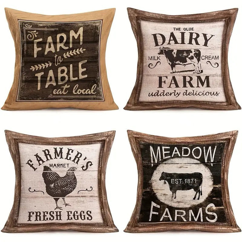 Four linen pillow covers featuring vintage farmhouse sign designs including Farm to Table, Olde Dairy Farm, Farmer’s Market Fresh Eggs, and Meadow Farms graphics.