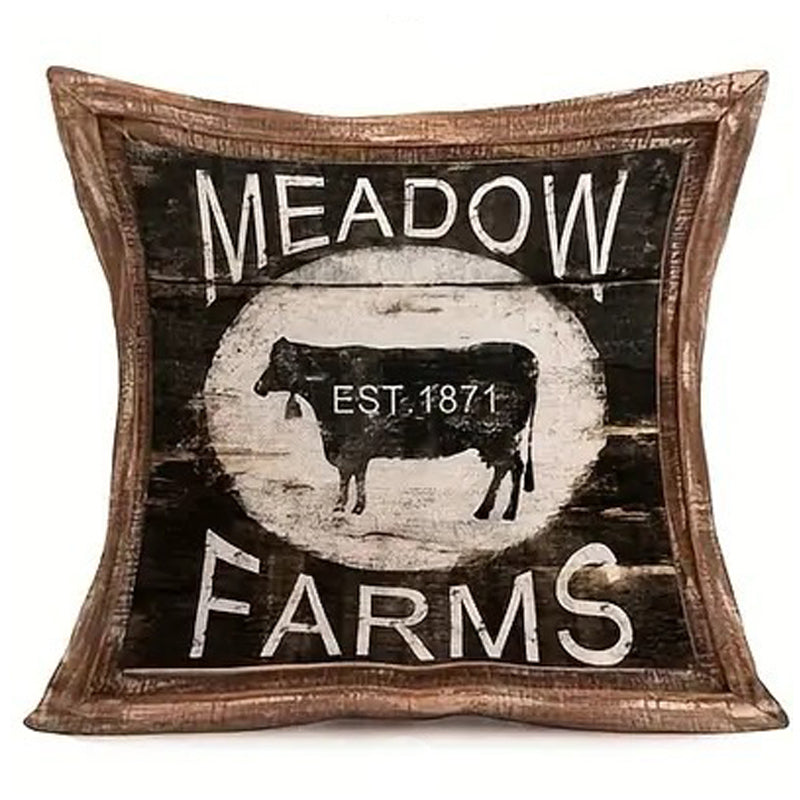 Linen pillow cover featuring a vintage Meadow Farms sign with livestock silhouette and wood-look framed border.