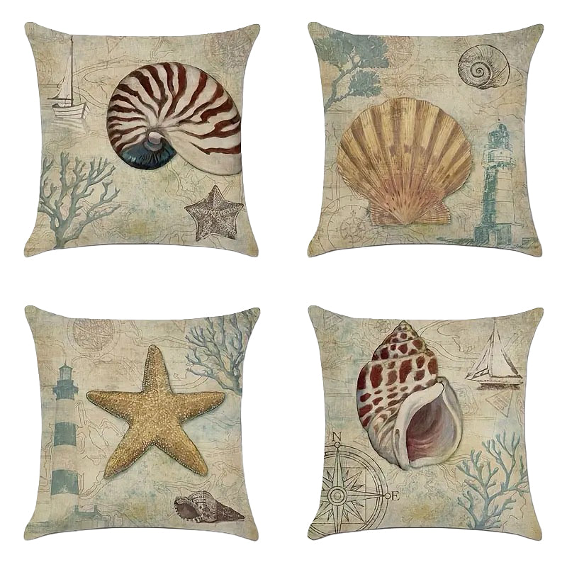 Set of four linen pillow covers featuring nautilus shell, scallop shell, starfish, and conch shell designs on a vintage nautical map background.