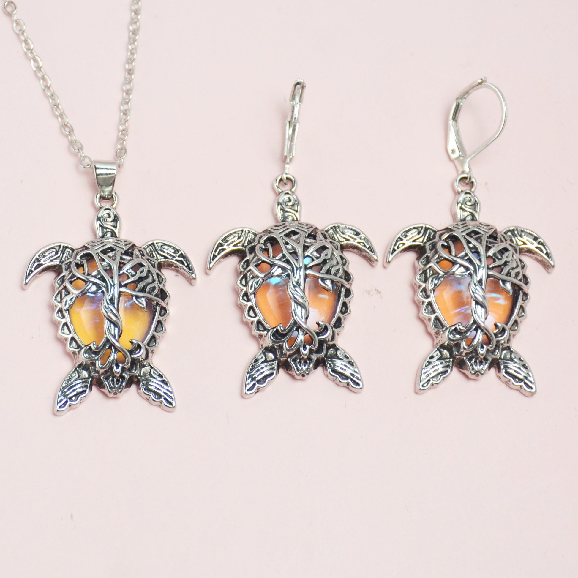 Playful 3-piece silver-tone sea turtle jewelry set with matching necklace and earrings for a coastal home décor vibe.