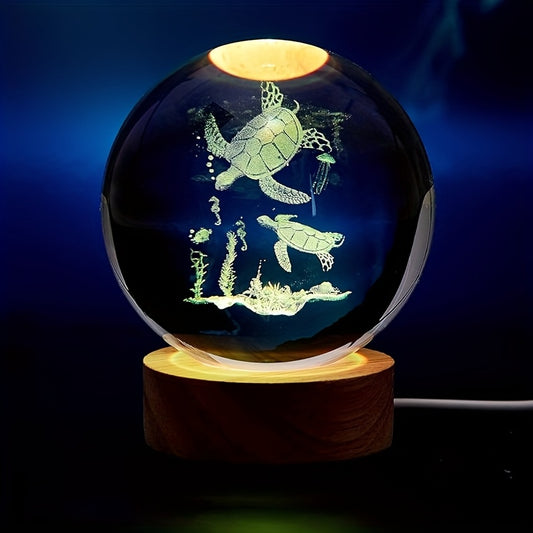 A 3D laser-etched sea turtle inside a glass sphere with 16-color LED light - Coastal Pillows Plus