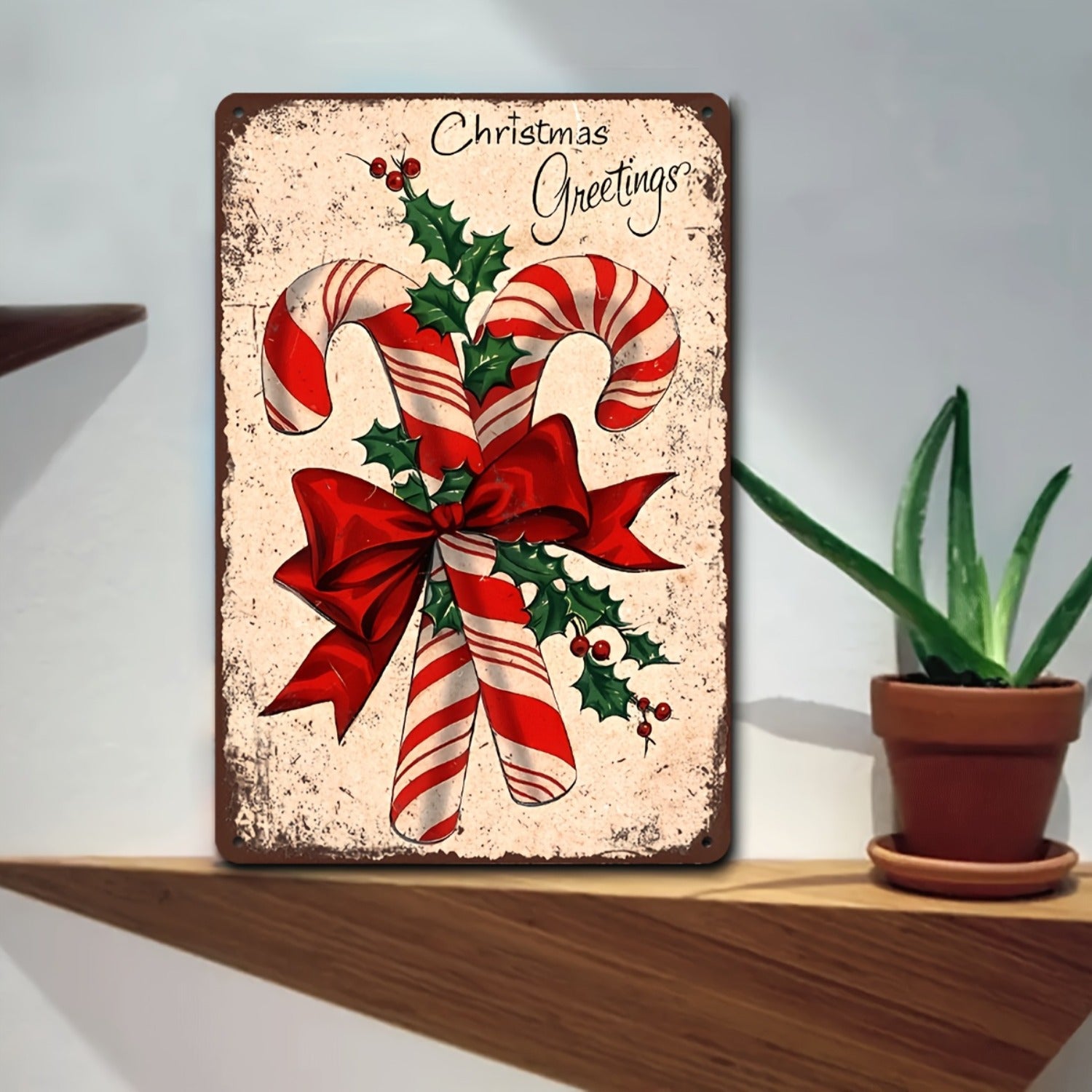 Nostalgic Christmas metal sign featuring candy canes and holly berries for traditional holiday décor – 8x12".
