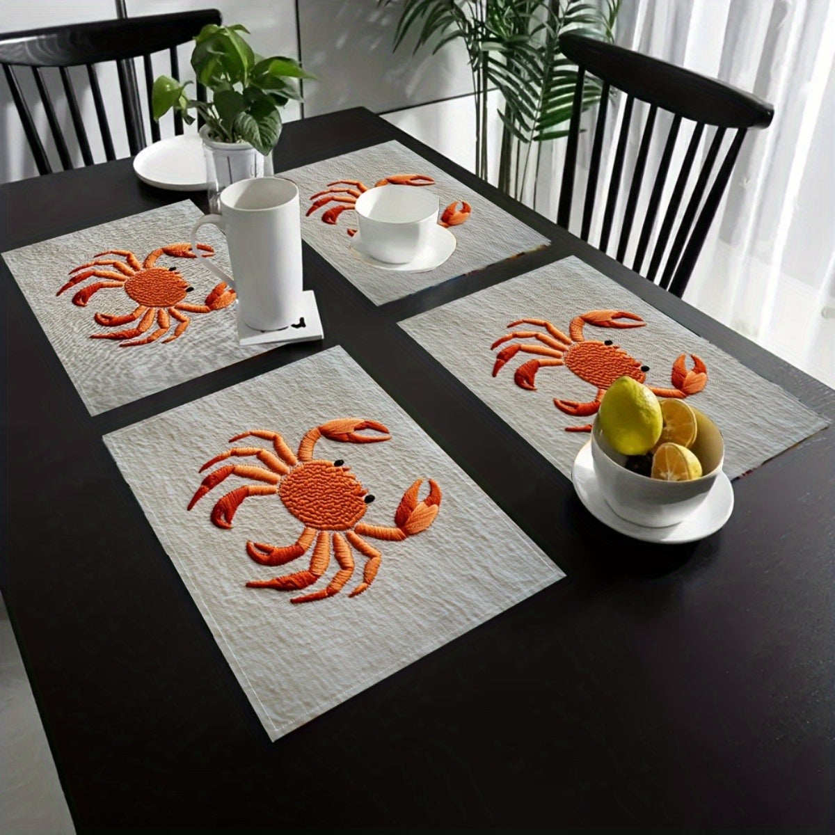Modern set of four minimalist orange crab typography table mats for ocean-inspired décor – Coastal Pillows Plus.