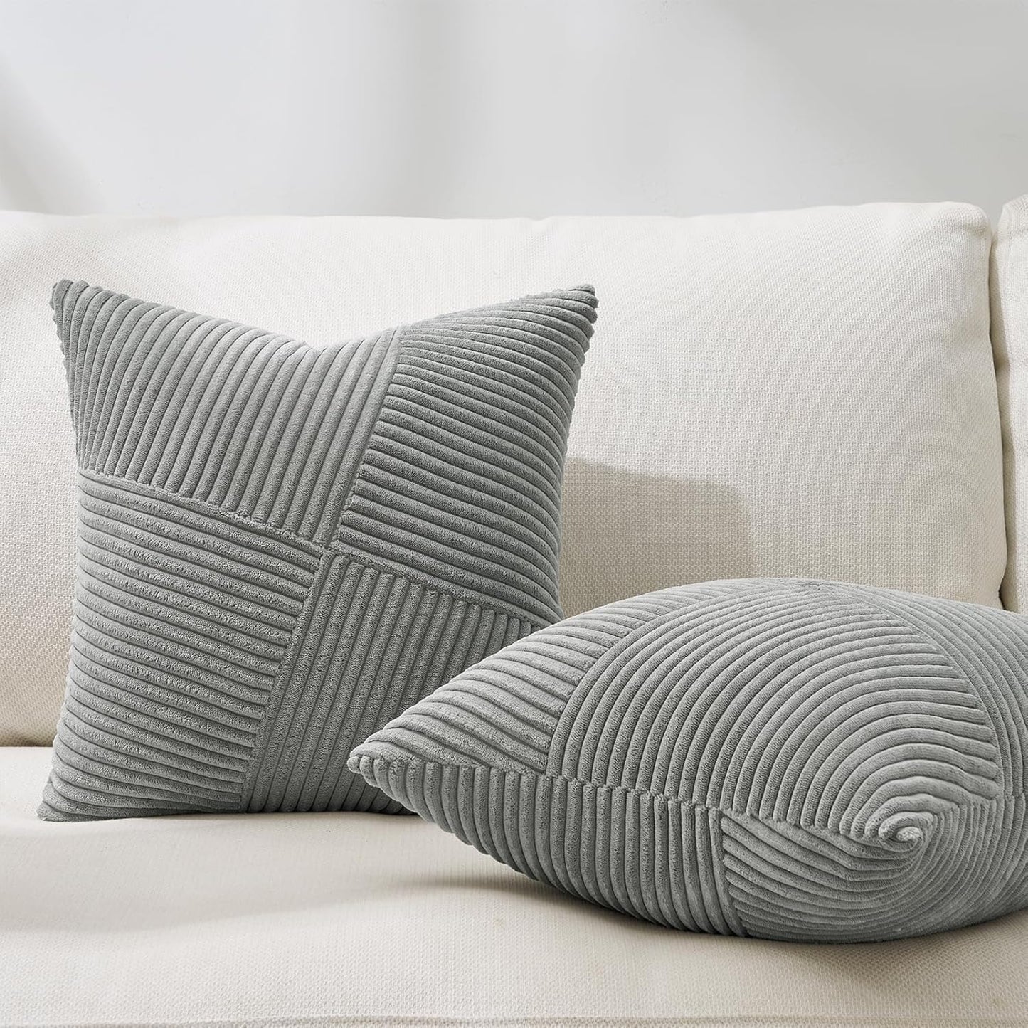 Soft 18x18 inch corduroy pillow cover with light and dark gray windmill striped splicing, styled on a sofa for bohemian décor – Coastal Pillows Plus.