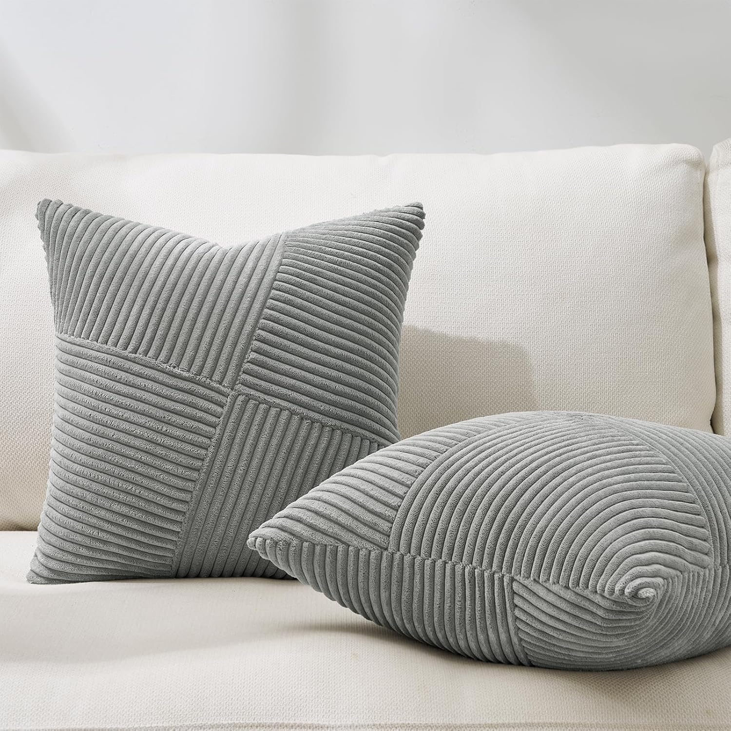 Soft 18x18 inch corduroy pillow cover with light and dark gray windmill striped splicing, styled on a sofa for bohemian décor – Coastal Pillows Plus.