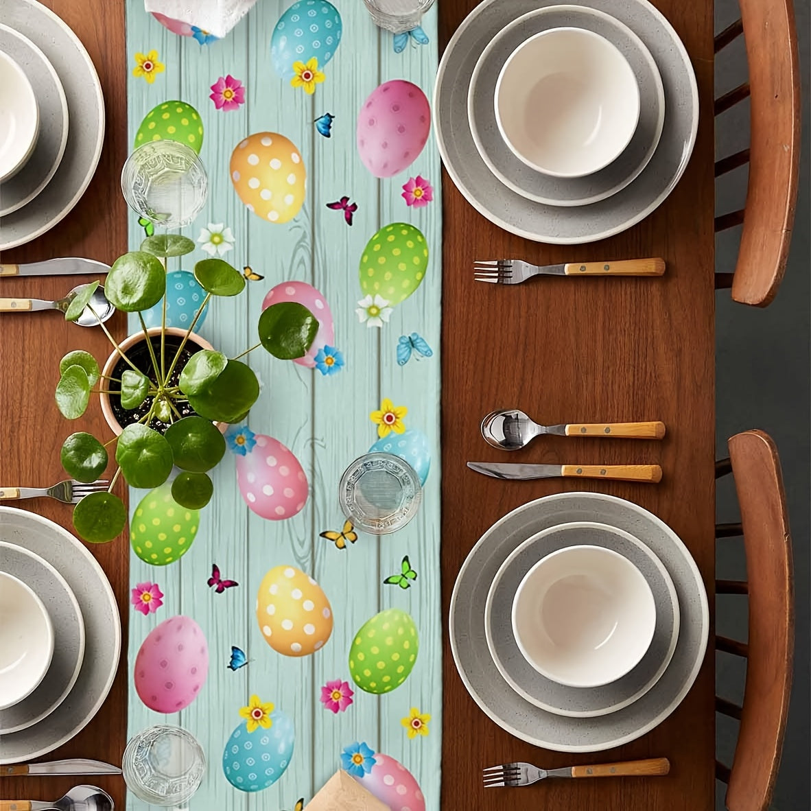 Fetching 13x90 inch triangular Easter table runner featuring a bunny bottom diving into a hole, with eggs and butterflies on a blue wood-grain background, styled on a table for spring holiday décor – Coastal Pillows Plus