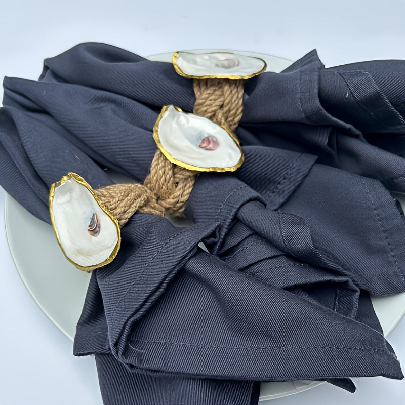 Organic wooden napkin rings featuring a golden oyster shell centerpiece, adding a refined and natural touch to your coastal home décor.