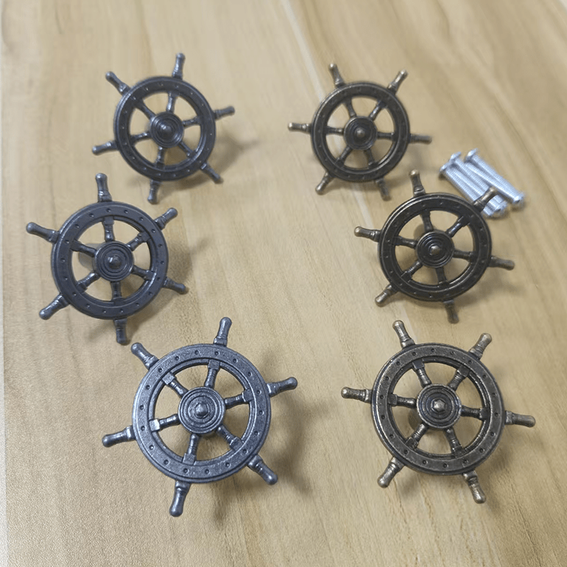 15-piece set of antique bronze ship helm cabinet handles featuring a vintage maritime design for a coordinated nautical décor look.