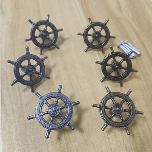 15-piece set of antique bronze ship helm cabinet handles featuring a vintage maritime design for a coordinated nautical décor look.
