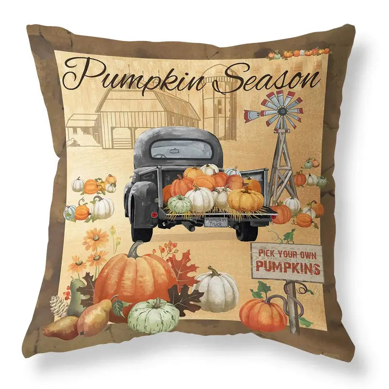 Pillow cover with Pumpkin Season text above gray truck filled with pumpkins, windmill, and harvest sign.