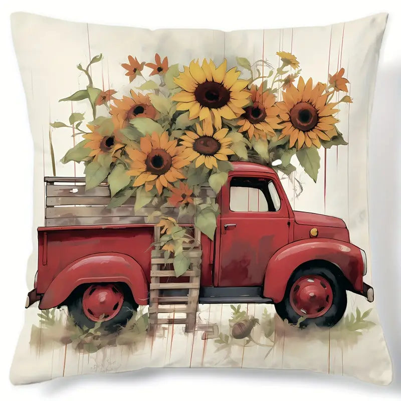 Pillow cover with red vintage truck carrying large sunflowers on a neutral wood-style background.