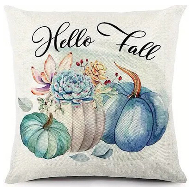 Pillow cover with Hello Fall text above teal and cream pumpkins with soft floral accents.