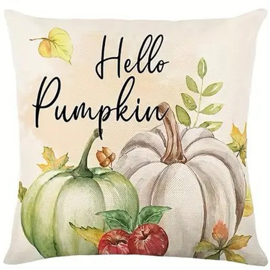 Pillow cover with Hello Pumpkin text above green and white pumpkins with apples and fall leaves.