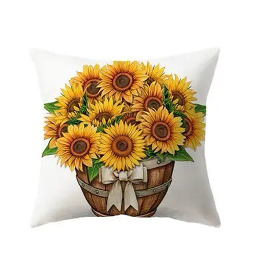 Pillow cover featuring a basket filled with sunflowers tied with a ribbon on a light background.