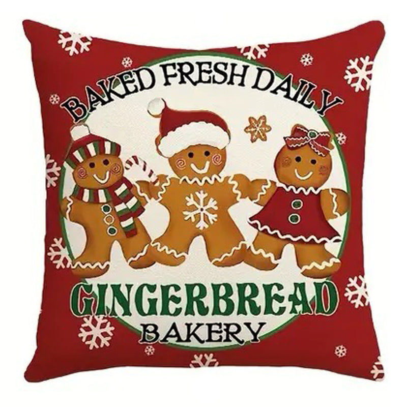 Christmas pillow cover featuring three gingerbread cookies with Baked Fresh Daily Gingerbread Bakery text.