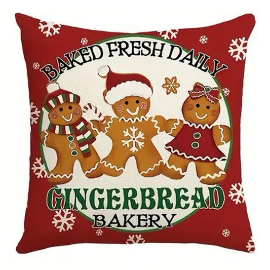 Christmas pillow cover featuring three gingerbread cookies with Baked Fresh Daily Gingerbread Bakery text.