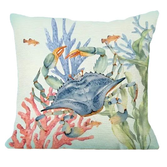 18"x18" linen pillow cover featuring a watercolor blue crab surrounded by coral and sea plants in soft ocean tones.
