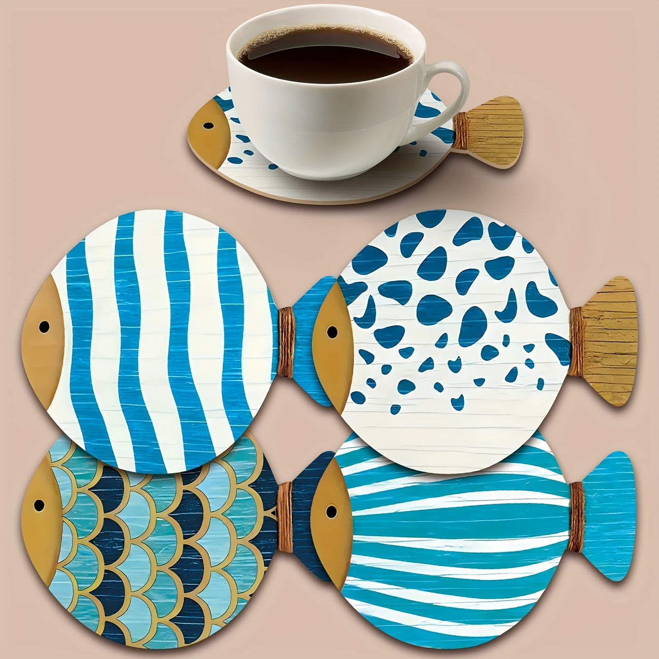 Blue and white fish shaped wooden coasters with striped and scale patterns with a coffee cup on one coaster.