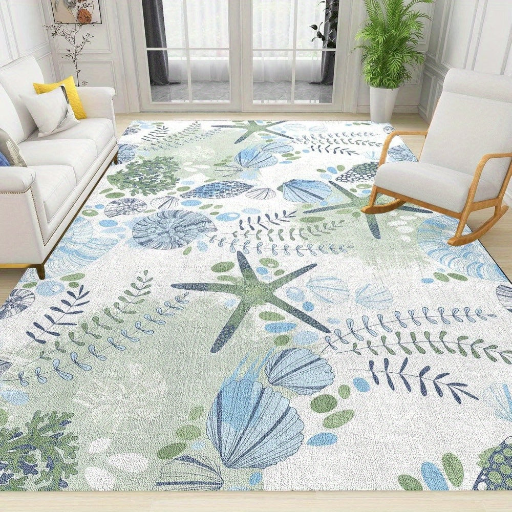 Coastal area rug featuring seashell and starfish patterns in blue and green tones on a soft neutral background.