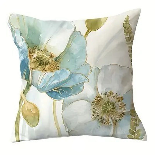 Decorative pillow cover featuring layered blue and white watercolor poppies with subtle gold accents and soft green stems.