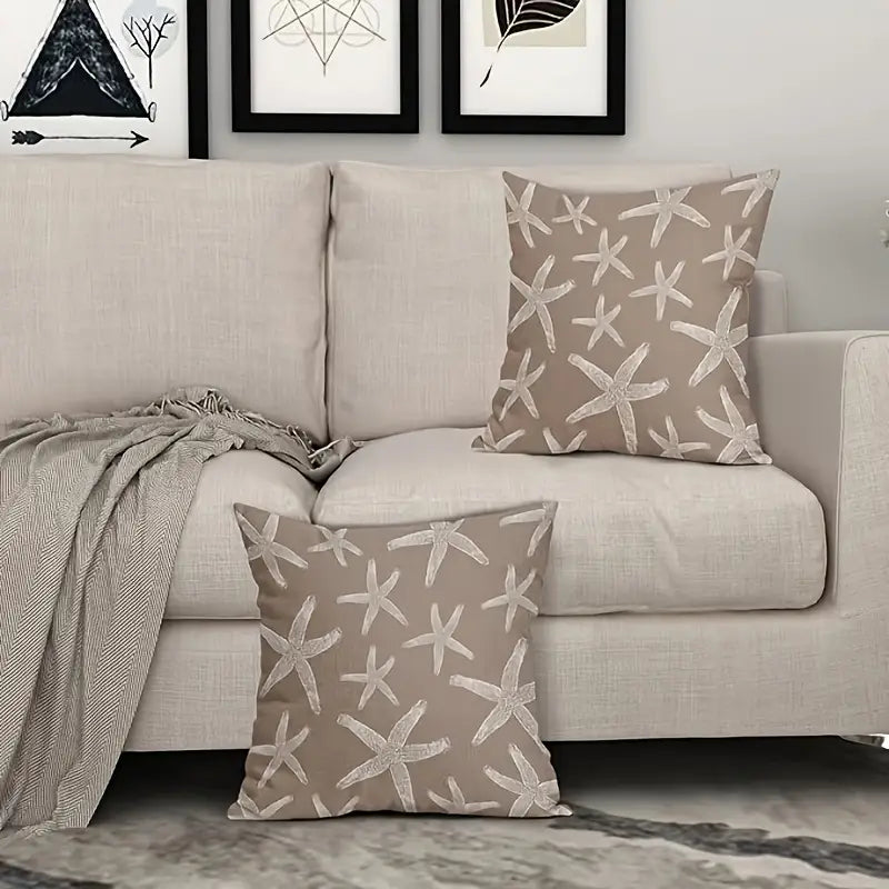 Brown pillow cover featuring a repeating ivory starfish pattern on woven fabric, styled on seating in a coastal-inspired setting.