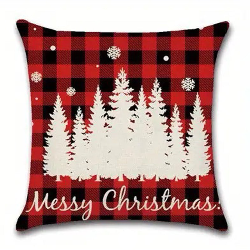 Red and black buffalo plaid pillow cover with a forest scene, snowfall, and text