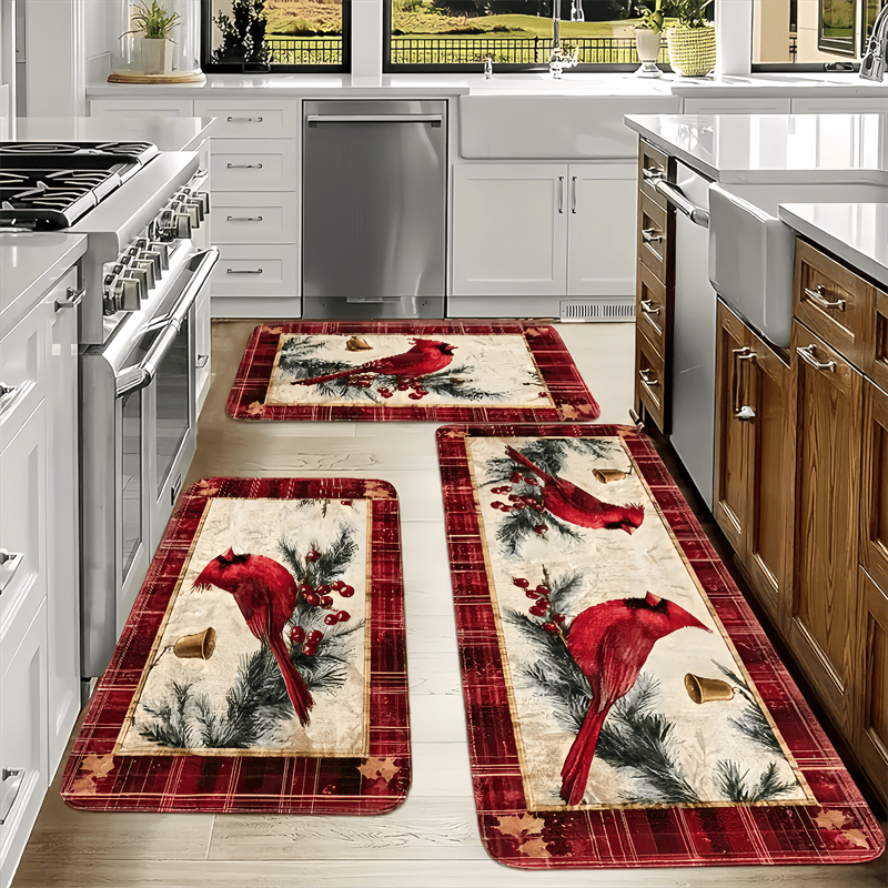 Holiday kitchen mat or runner featuring red cardinals, pine branches, and festive accents on a red plaid background.