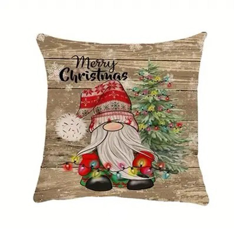 Christmas pillow cover featuring a gnome holding holiday lights with a Christmas tree on a rustic wood background.