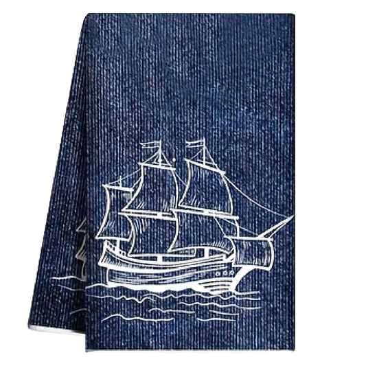 Navy blue textured hand towel with a white clipper ship illustration sailing on ocean waves - Coastal Pillows Plus