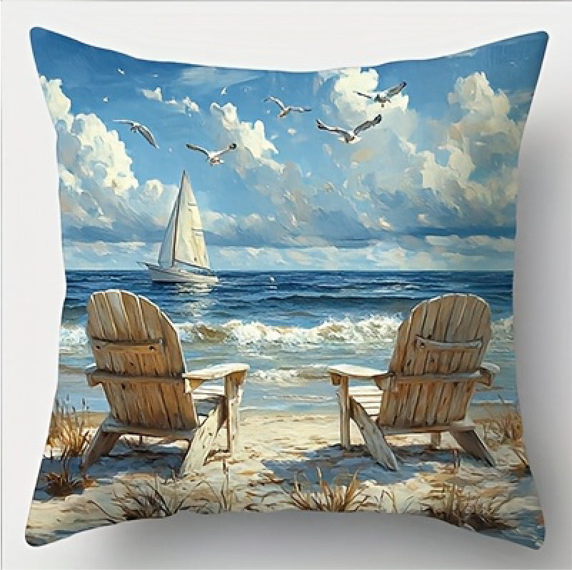 Coastal pillow cover featuring two wooden beach chairs facing the ocean with a sailboat on the horizon and seabirds in the sky.