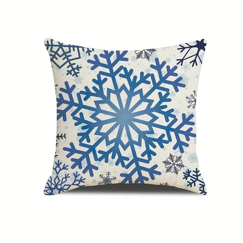 Blue snowflake coastal winter pillow cover on a light background with large centered snowflake design.