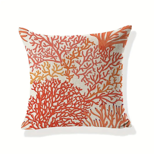 Coastal pillow cover featuring orange and red coral patterns on a neutral background.