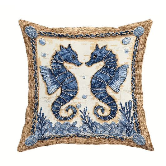 Blue and cream coastal outdoor pillow cover featuring mirrored seahorses with burlap-style border and hidden zipper closure, shown on a white background.