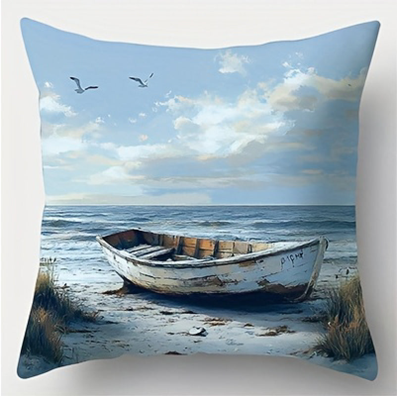 Coastal pillow cover featuring a wooden beach chair facing the ocean with a white cat on a nearby stool and seabirds in the sky.