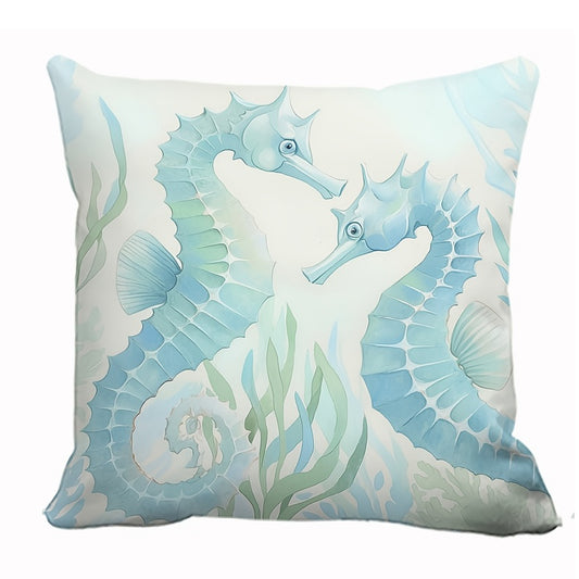 Coastal pillow cover featuring two illustrated seahorses among sea plants and shells in soft blue and green tones.
