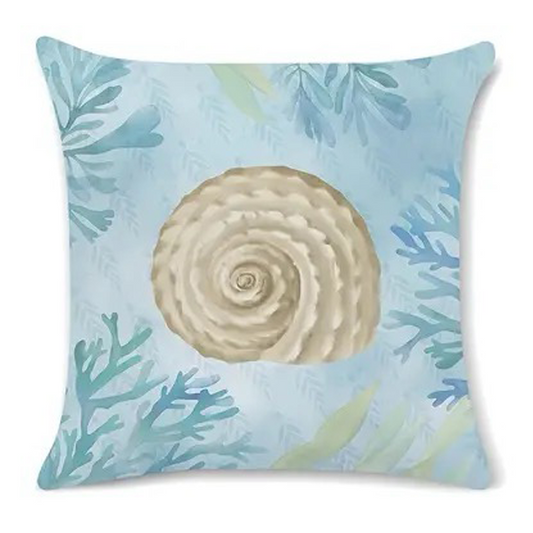 Coastal pillow cover featuring an illustrated spiral seashell with blue and green sea plants.