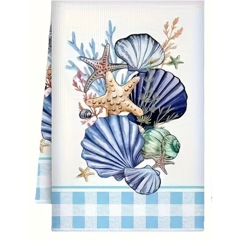 Decorative towel with sea-themed design featuring shells, starfish, and seaweed on a white background.