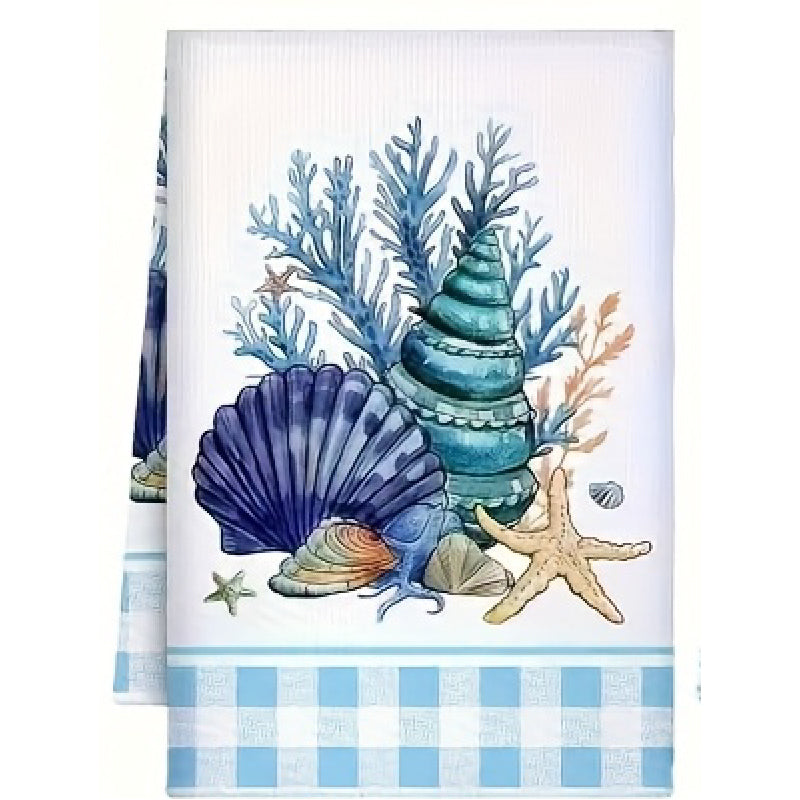 Towel with seashell, starfish, and coral design on a white background