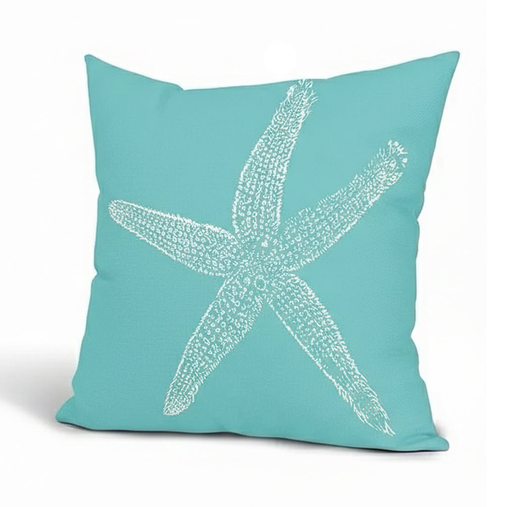 Cerulean blue linen pillow cover featuring a white starfish design on textured fabric background.
