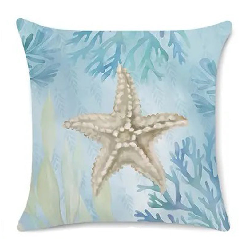 Coastal pillow cover featuring an illustrated starfish on a soft blue background with sea plants.